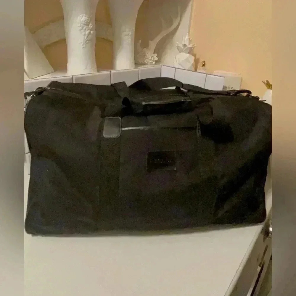 Escoda large travel bag waterproof, long adjustable straps fit a lot of stuff